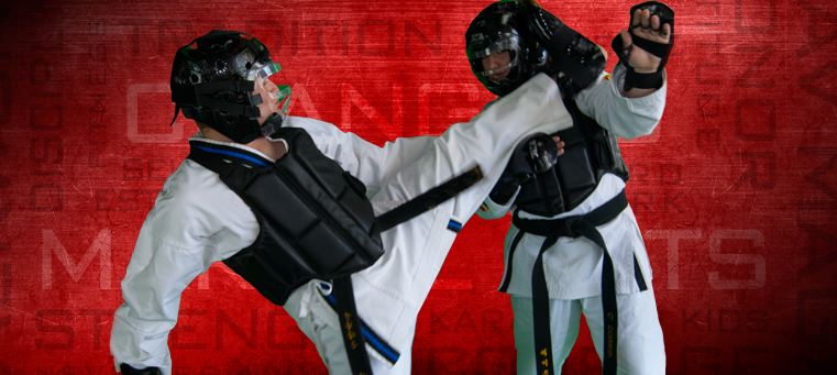 two men sparring with karate gear on